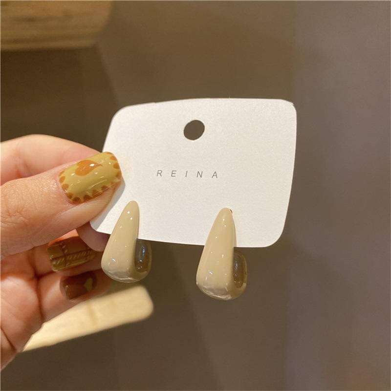     			Adornity Cream Stud Earrings ( Pack of 1 )