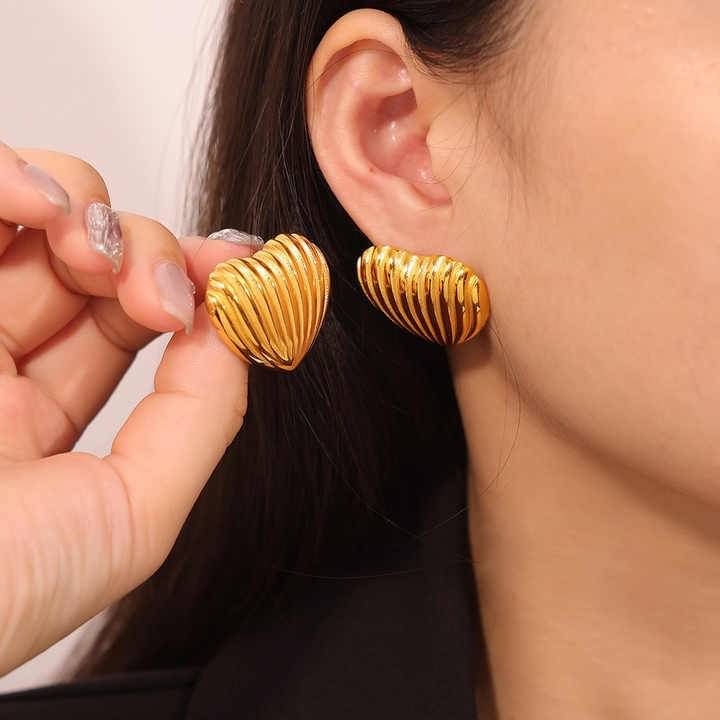     			Adornity Gold Stud Earrings ( Pack of 1 )