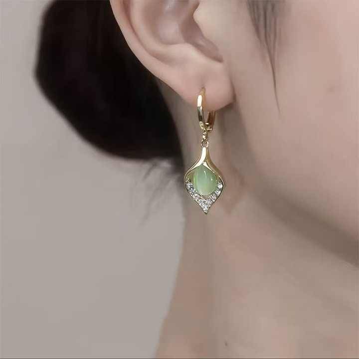     			Adornity Green Stud Earrings ( Pack of 1 )