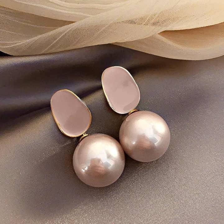     			Adornity Peach Stud Earrings ( Pack of 1 )