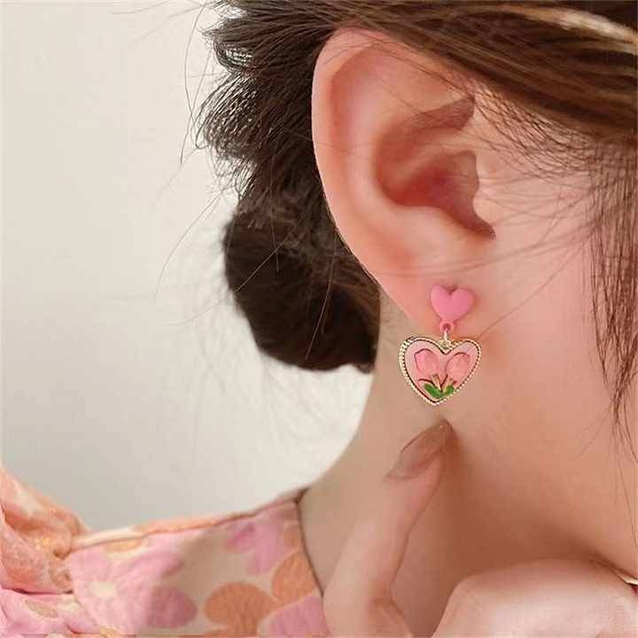    			Adornity Pink Stud Earrings ( Pack of 1 )