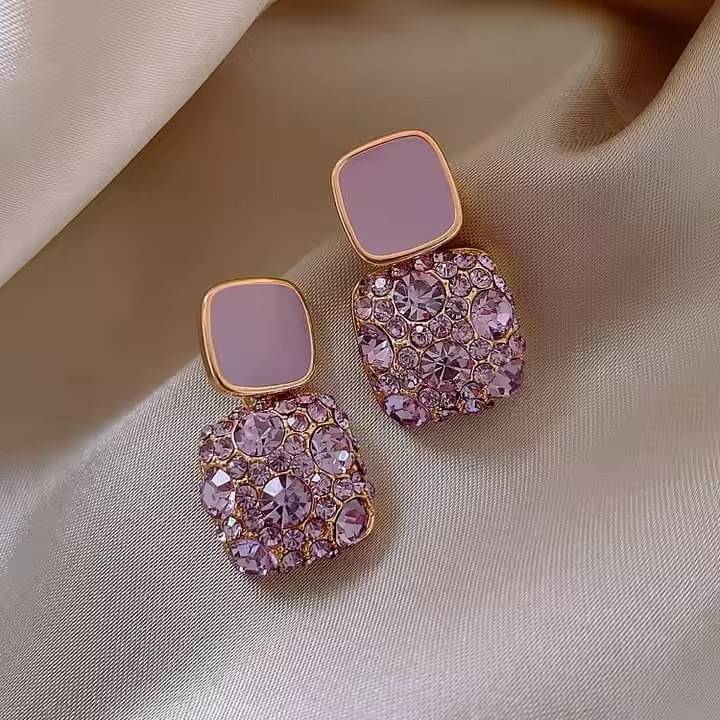     			Adornity Purple Stud Earrings ( Pack of 1 )