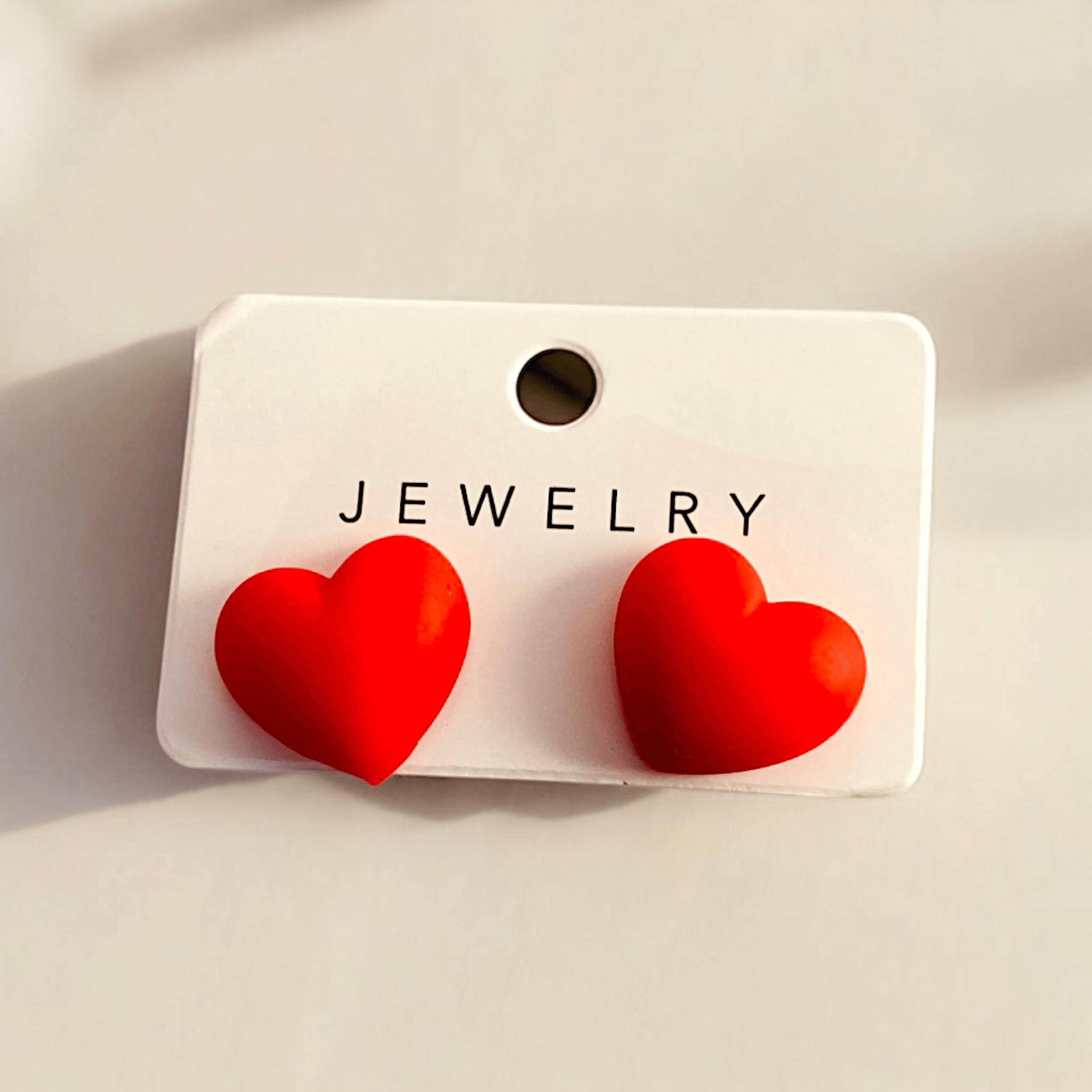     			Adornity Red Stud Earrings ( Pack of 1 )