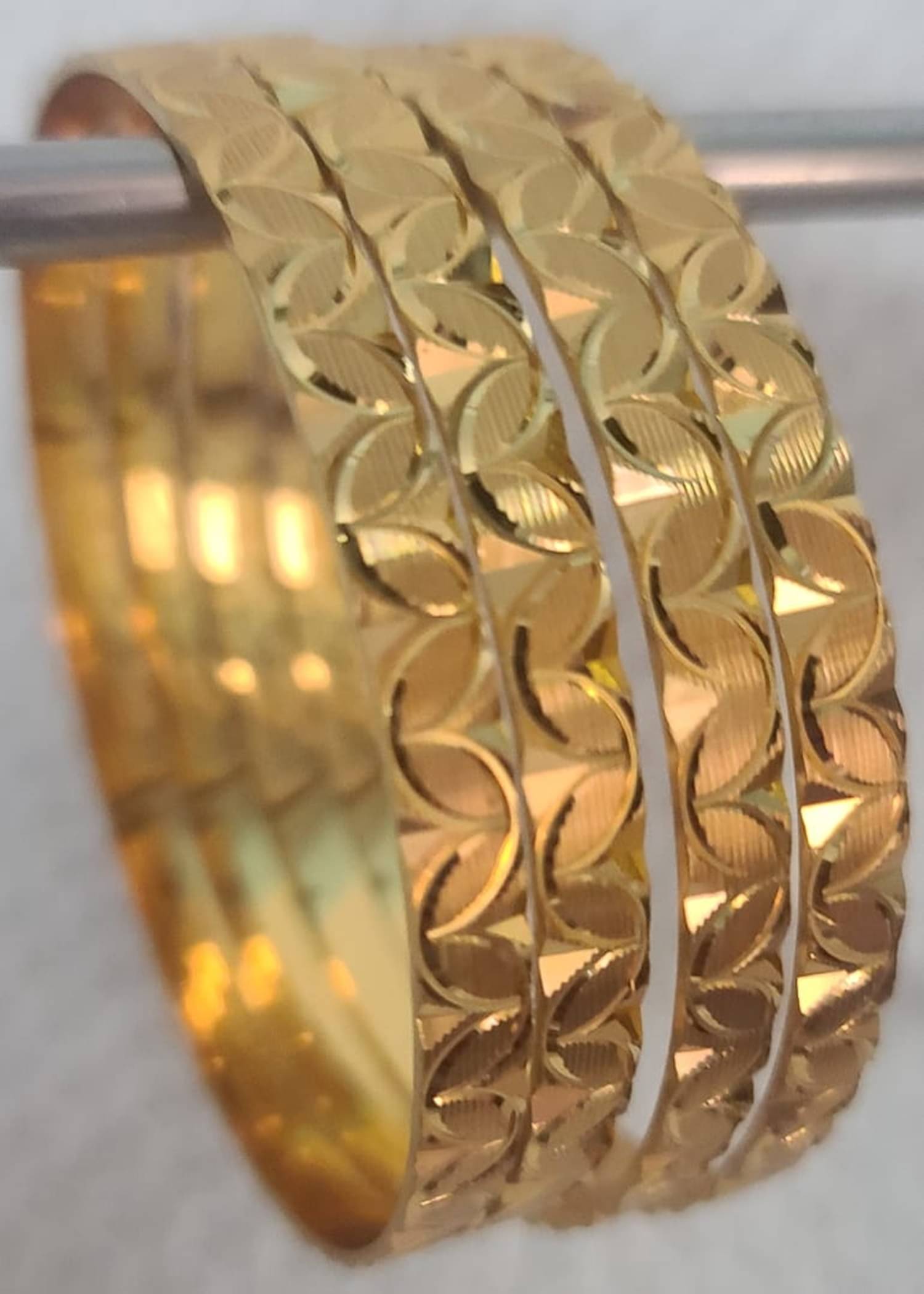 Iivaas Gold Bangle Set ( Pack of 4 ) Iivaas Gold Bangle Set ( Pack of 4 )