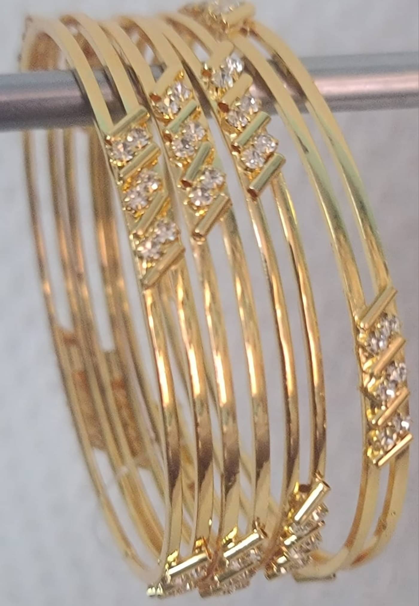 Iivaas Gold Bangle Set ( Pack of 4 ) Iivaas Gold Bangle Set ( Pack of 4 )