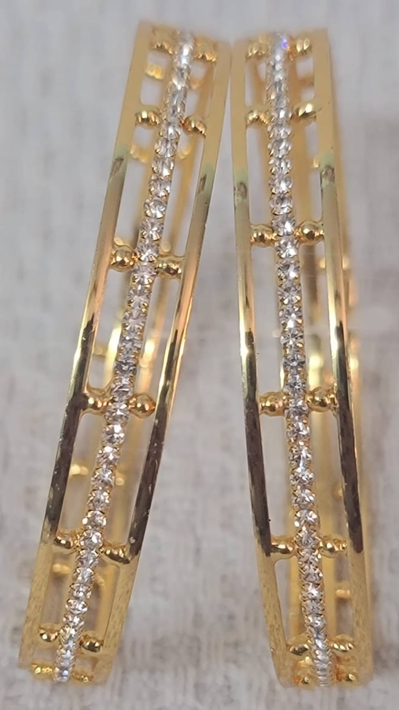 Iivaas Gold Bangle Set ( Pack of 2 ) Iivaas Gold Bangle Set ( Pack of 2 )