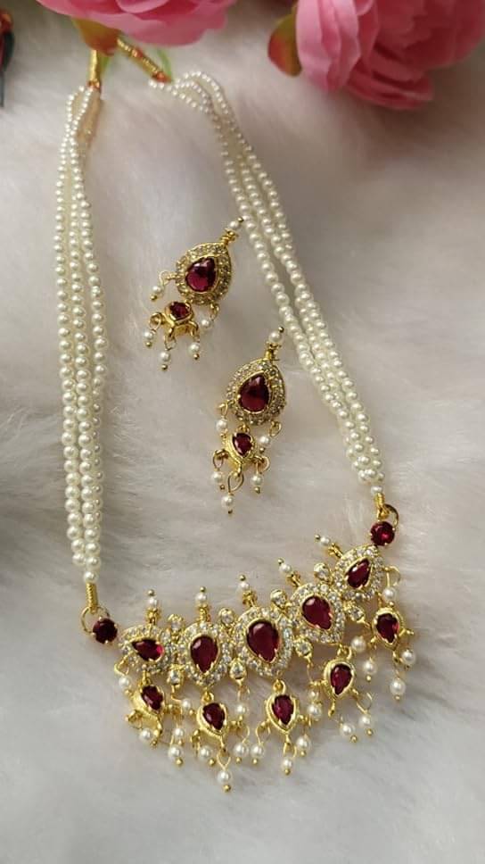     			SAJSHRUNGAR JEWELLERY Pink Copper Necklace Set ( Pack of 1 )