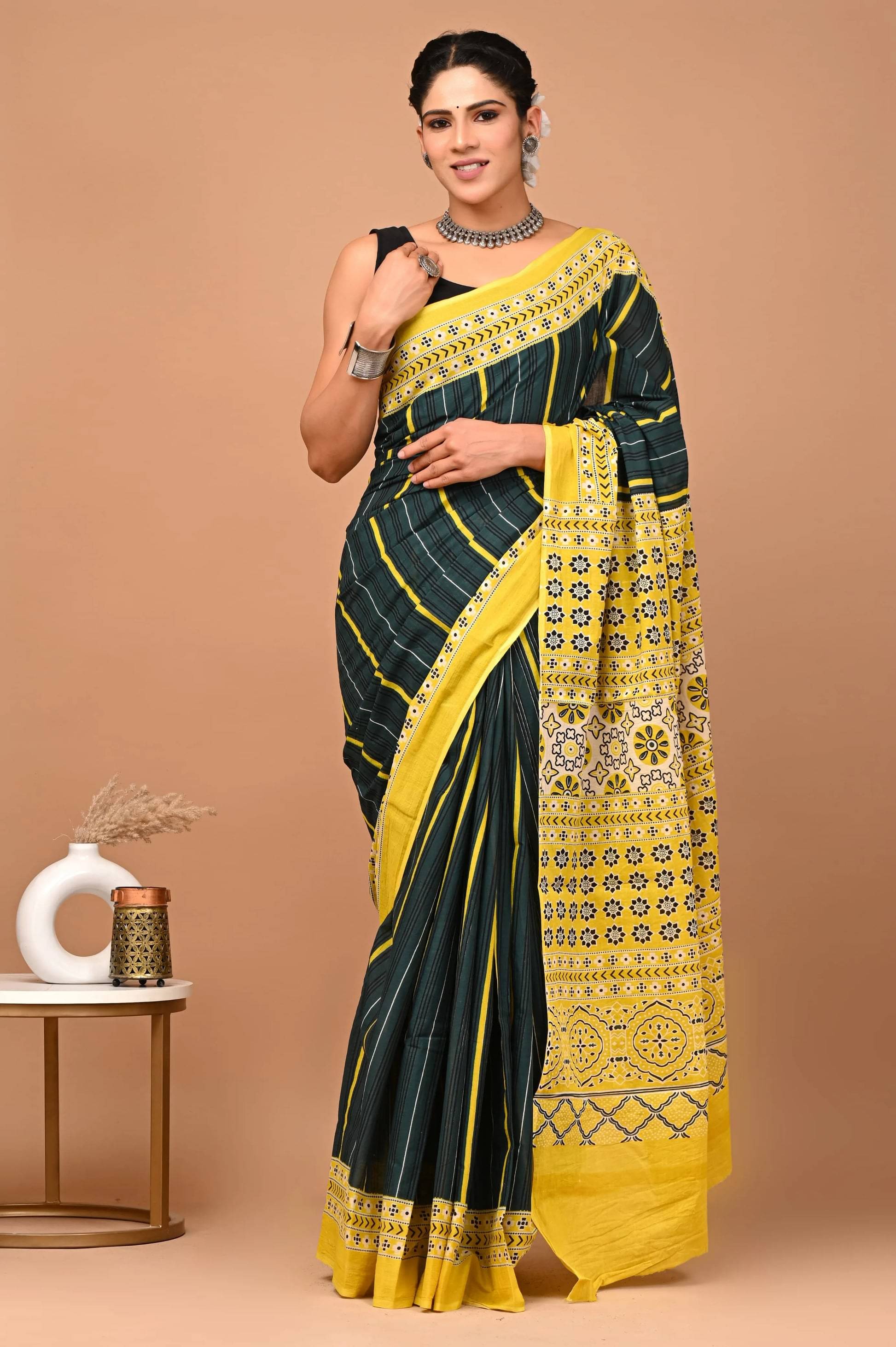 Lovwear Cotton Printed Regular Saree With Unstitched Blouse Piece ( Black,Yellow )     			Lovwear Cotton Printed Regular Saree With Unstitched Blouse Piece ( Black,Yellow )