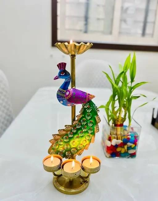 BALAJI INC. Metal Peacock Tea light candle holder showpiece Table Decorative showpiece Tealight Candle Holder / Diya Holder / Loban Dhoop / Incense Burner for Diwali Decoration, Diwali Gift, Corporate Gift, Table Decor, Pooja Room Decor. BALAJI INC. Metal Peacock Tea light candle holder showpiece Table Decorative showpiece Tealight Candle Holder / Diya Holder / Loban Dhoop / Incense Burner for Diwali Decoration, Diwali Gift, Corporate Gift, Table Decor, Pooja Room Decor.